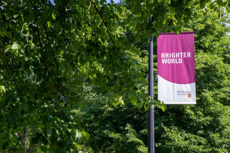 Brighter World campus banner on the Burke Science Building field.